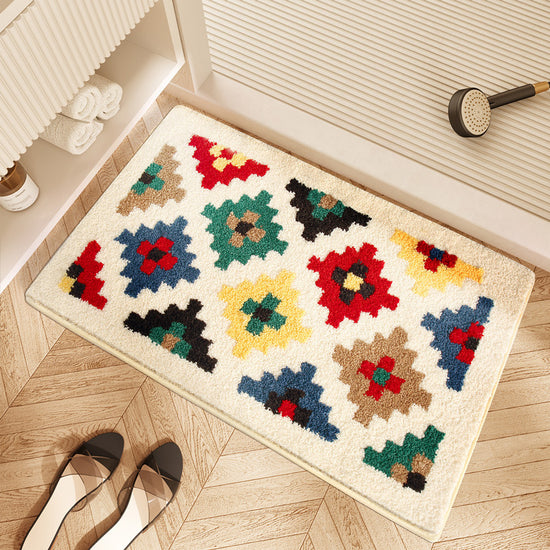 Soft absorbent plaid bath rug on a tiled bathroom floor.