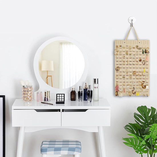 Rustic wooden jewelry holder with hooks and shelf for accessories.